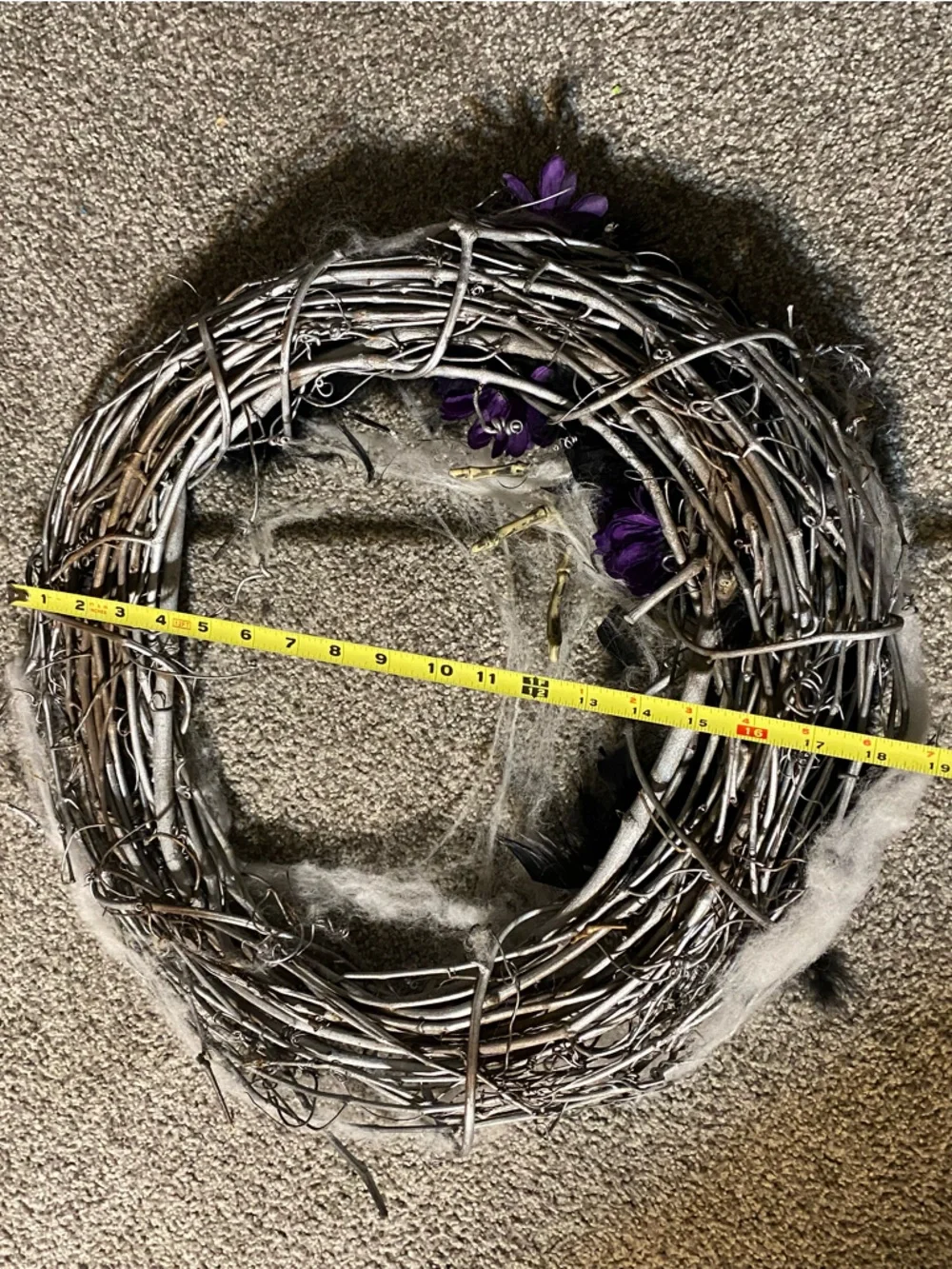 Halloween wreath with spider skeleton, flowers and cobwebs